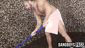 Man with muscles is stroking his giant prick under the shower