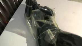 Girl In 2 Layers Of Latex Catsuits Black + Transparent With Gas Mask + Piss