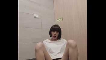 Shemale Ting Xuan masturbating with a dildo in a public toilet