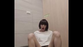 Shemale Ting Xuan masturbating with a dildo in a public toilet