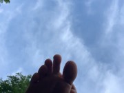 Redhead barefoot soles outside public