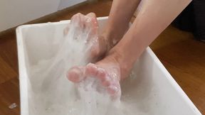 Bare feet covered in sticky superglue