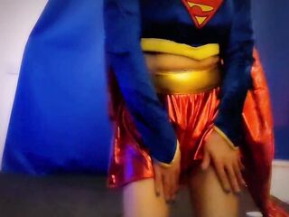 SuperGirl in Shiny Spandex Teases and Plays with Herself