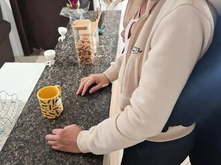 A stepdaughter is surprised while having breakfast.