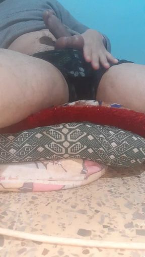 Pulling down his pants and masturbating in his underwear on his phone