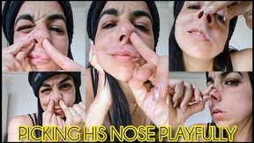 Picking his nose playfully