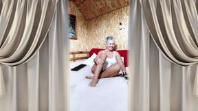 Hot Housewife Lukerya in Satin White Lingerie on a Large Soft Bed