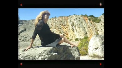Blonde explores her foot fetish on desert rocks before moving to intimate softcore moments