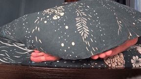 male and female feet under the blanket b