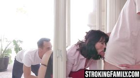 MILF sucks two members in a spitroast