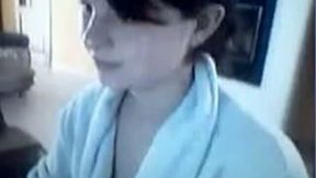 Cute teen wearing a bathrobe flashes her tits and pussy for the cam