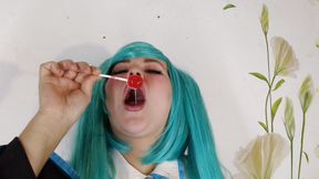 Miku is sucking on the candy and drooling