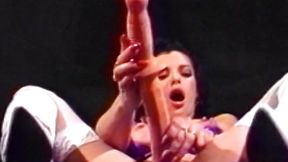Lovely lesbian strips down and impales her cooch and ass