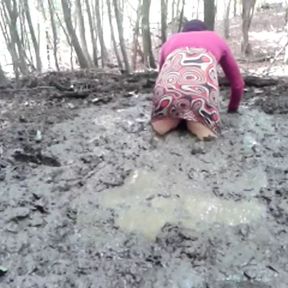 in a mini dress she is playing in the mud