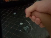 A young guy jerks off an uncut huge cock and ends up with a fountain of sperm