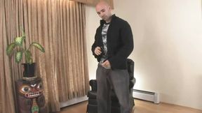 Sexy bald man in his leather chair
