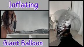 Inflating a giant balloon silver