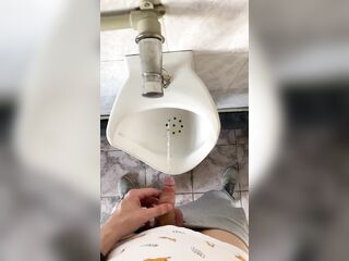 Guy pissing with big uncut dong in public latrine in slow motion POV