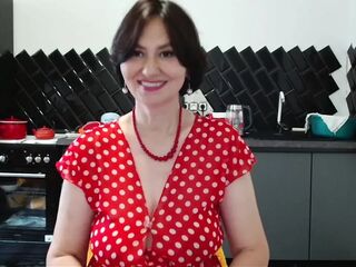 her polka-dot suit widen to the sides