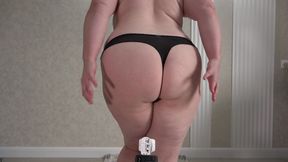 A mature big ass tries on panties, shorts and records a sexy video for her lover. A home camera watches a plump wife. PAWG.