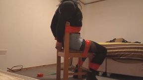 Red ductaped chairtied crossdresser