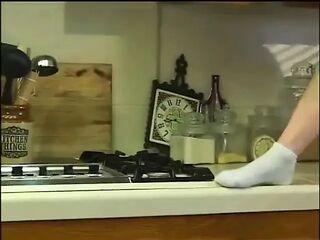 Sexy cheerleader sucking jock in kitchen