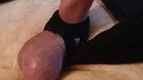 Miss M cock and balls tied with stockings of a strapped down and gagged man