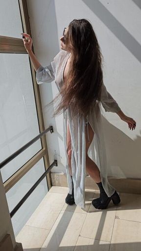 Sensual and horny brunette with transparent dress play with sun dance and make a sensual streap until remove all clothes and go all naked