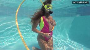 ”Charming teen Irina Poplavok swims naked underwater”