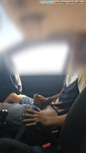 Cumming in a car by the road