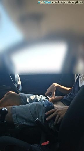 Cumming in a car by the road