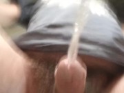 Never-ending pee. View from the bottom of a glass. Balls and uncut POV