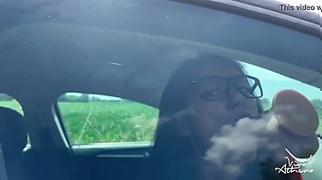 Horny Indian girl with glasses dildoing herself in the car