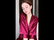 Red robe slips open as she teases her wet slit