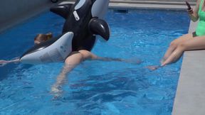 Lesbian Girls Are Having Fun in a Pool with an Inflatable Shark