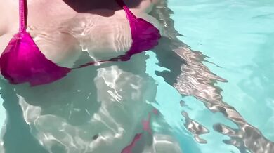 Italian MILF’s big tits spill out in public pool water her bikini slipping and drooling