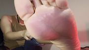 Feet in Jeans With Black Sexy Toe Nails
