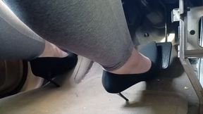 Black suede pointed toe spike pumps driving van