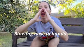 Blow trumpet nose in hands