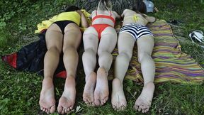 Anett, Kira and Stacy sunbathing barefoot in a public park (Part 5 of 6)