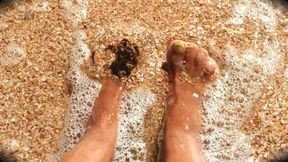 A Lonely Housewife in the Sun Caresses Her Sexy Legs on the Sea Waves