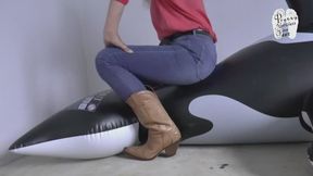 Two inflatable Orcas under Cow Girl Boots