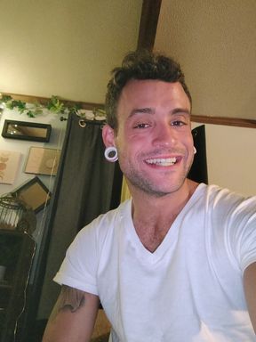Young twink jerks off in friends bed