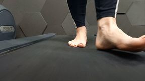 Giant sweaty feet walk on a treadmill