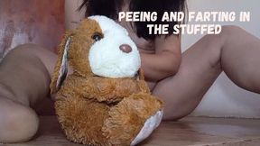 Peeing and farting in the stuffed dog