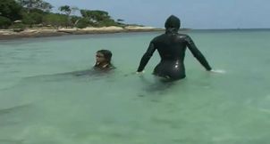 Swimming in the ocean with ebony babe