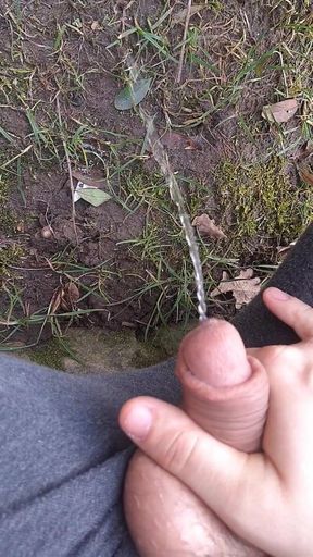 German Teen Boy sitting outside and pissing