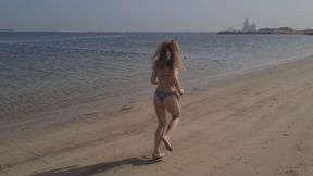 running and stretching on the beach