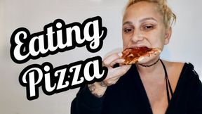 Eating pizza