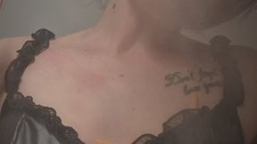 Crystal inhales three Marlboro Red cigarettes, one after the other, dressed in a leather corset.